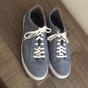 Cole Haan sneakers light blue jeans.